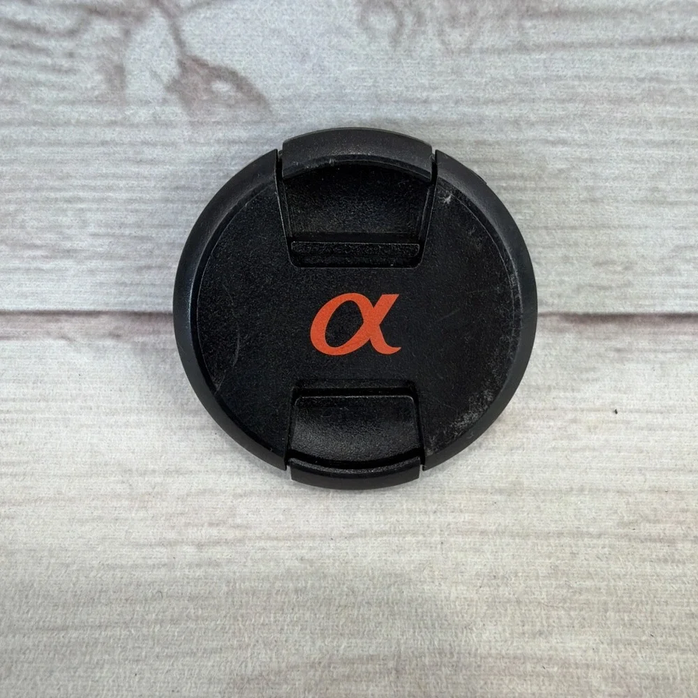 SONY ALPHA 55mm LENS FRONT COVER Black Genuine